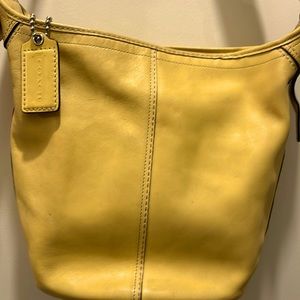 COACH bright sunshine leather bucket purse with adjustable silver buckle